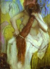 Haga click para ver la imagen ampliada woman combing her hair.jpg